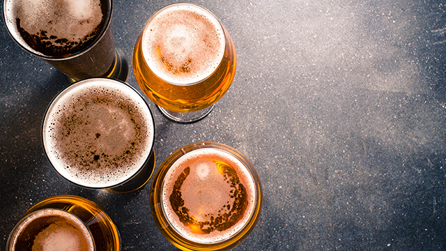 beer glasses on dark table